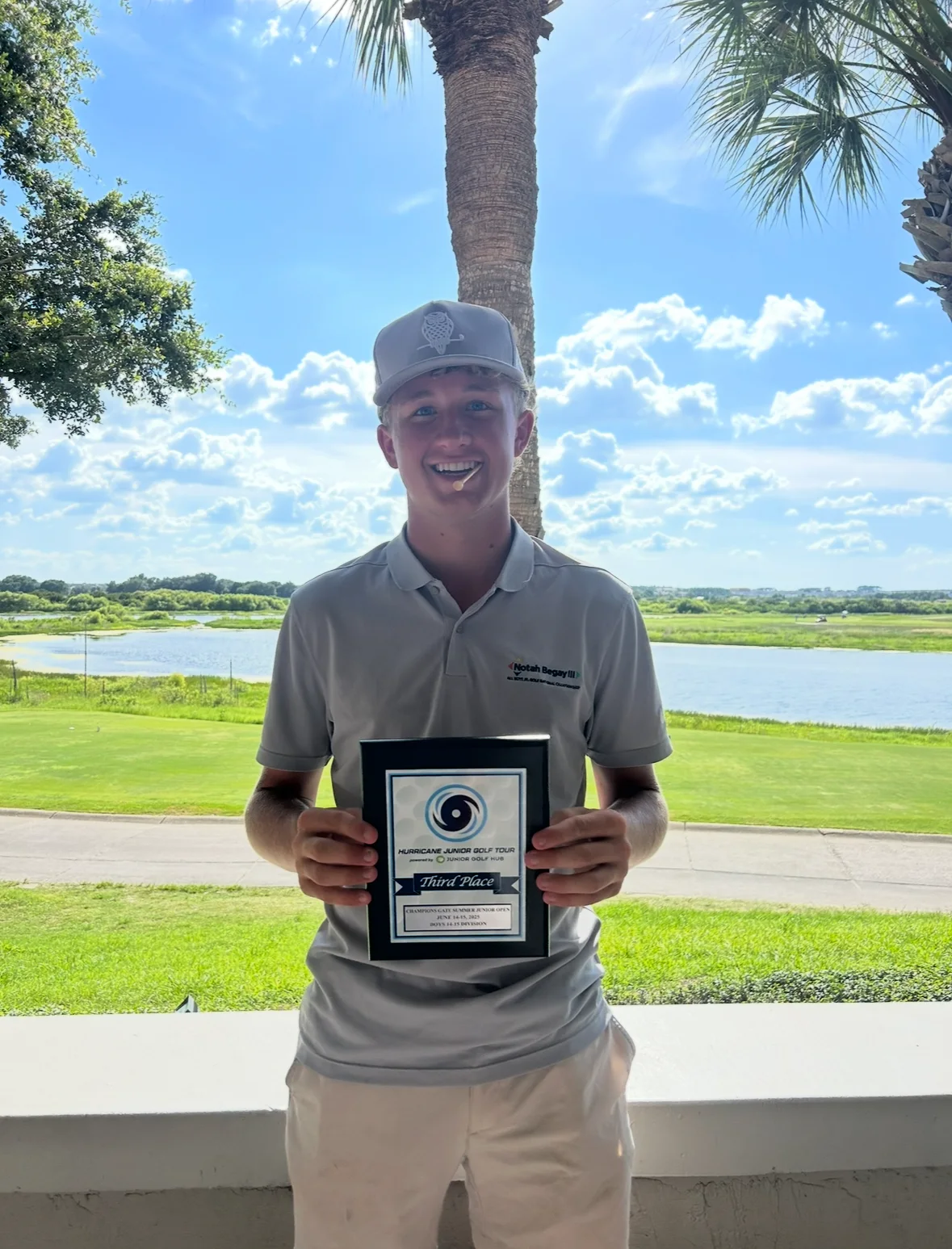 Peter Sirianni holding a Hurricane Junior Golf Tour third-place award